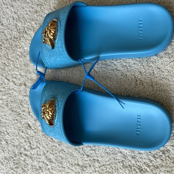 Versace Electric Blue Slides. New w/o tags or box.Never worn.